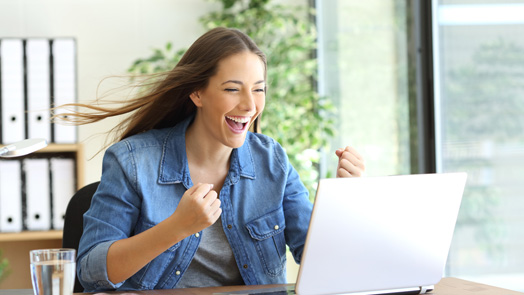 Excited entrepreneur working on line