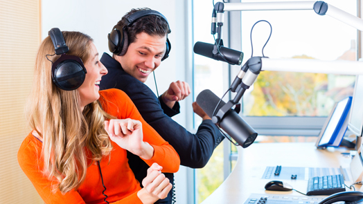 radio presenters in radio station on air