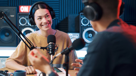 Radio host interviewing a guest in the studio